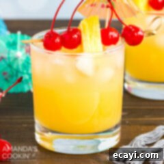 The Ultimate Mai Tai 6 A glass of Mai Tai cocktail with cherry and pineapple garnish