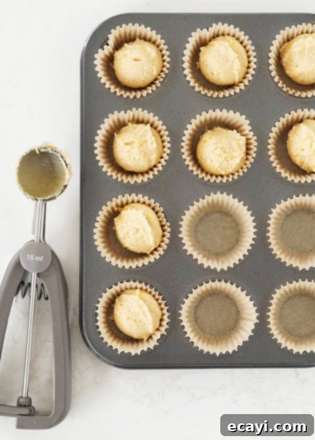Bake Elegant French Financiers: The Classic Recipe & Exciting Flavor Innovations 8 How to portion financier batter quickly and easily: with a cookie scoop! // FoodNouveau.com
