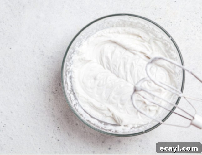 Sunshine Orange Yogurt Cake with Zesty Citrus Cloud 3 Whipped cream is an easy way to dress up easy yogurt cake! // FoodNouveau.com