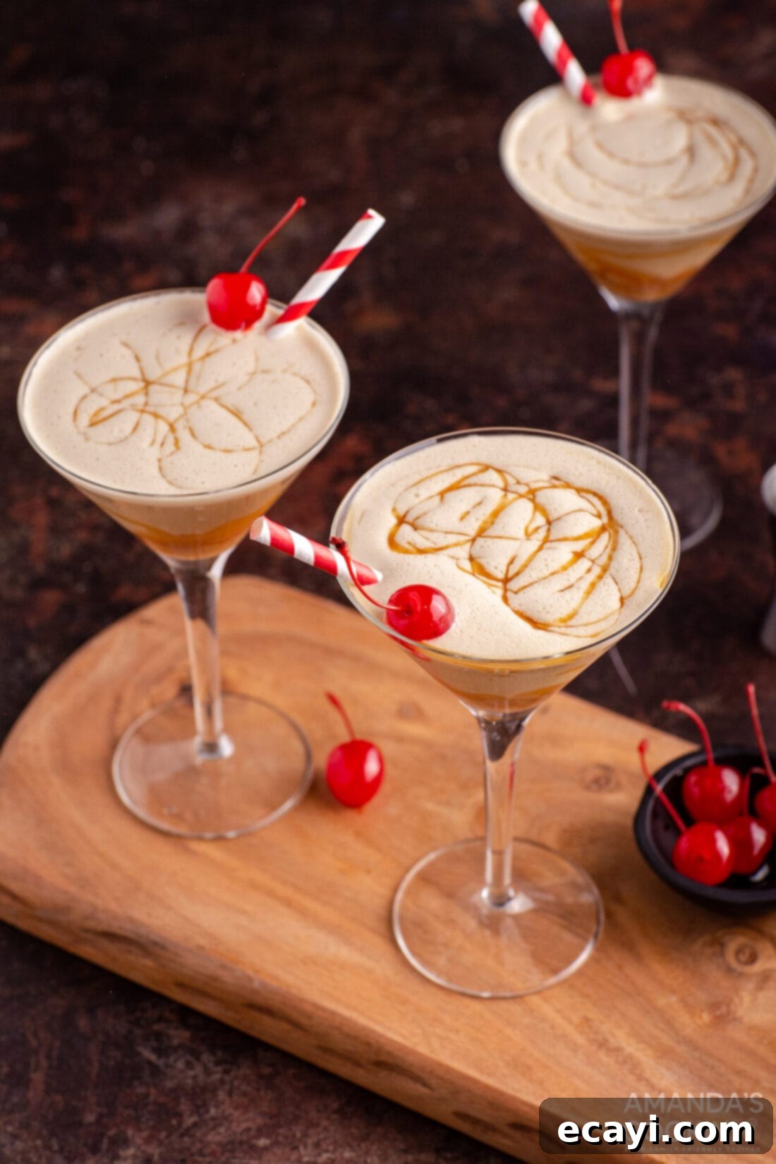 Butterscotch Velvet Sip 3 butterscotch milkshake cocktail in a martini glass with a cherry garnish