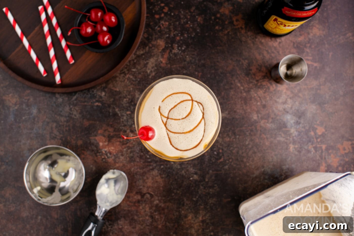 Butterscotch Velvet Sip 8 butterscotch milkshake cocktail in a martini glass with a cherry garnish