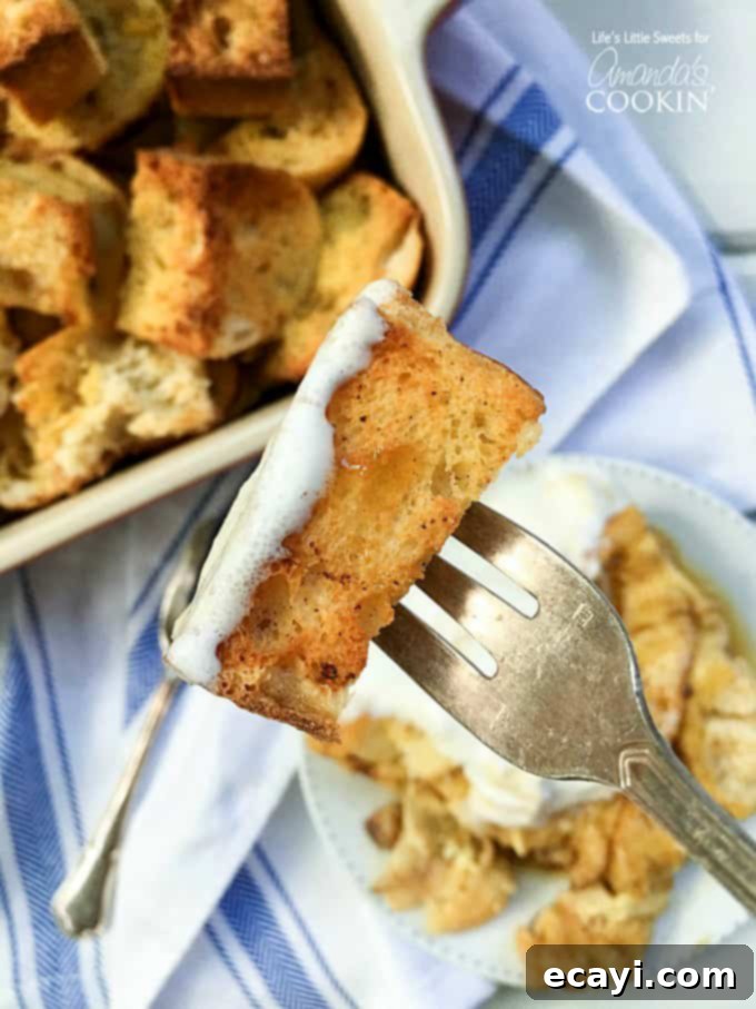 Overnight French Toast Bake 3 A piece of french toast casserole on a fork.