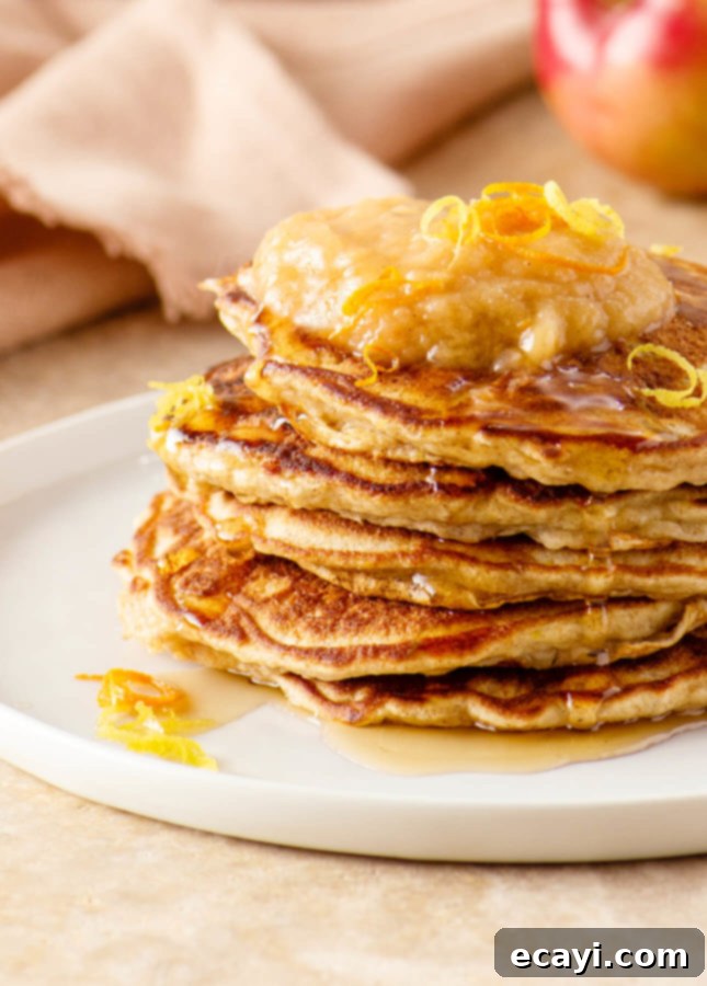 Whole Wheat Apple Pancakes with Zesty Citrus Applesauce 5 Freshly cooked whole wheat apple pancakes on a cooling rack
