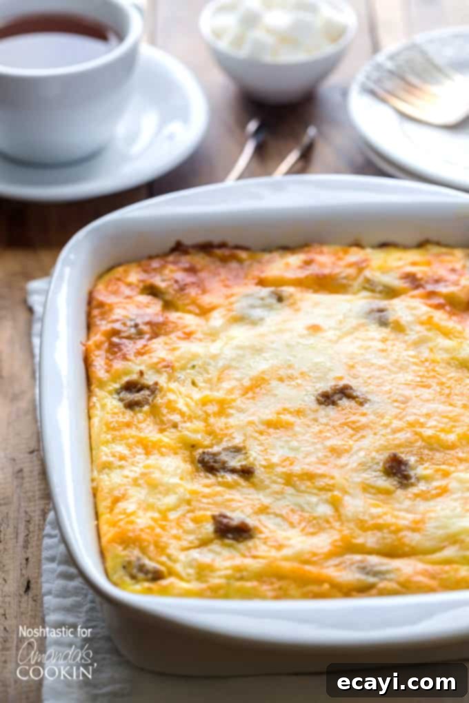 Hearty Turkey Hash Brown Breakfast Bake 2 A close up of a white baking dish filled with fresh baked turkey hash brown breakfast casserole