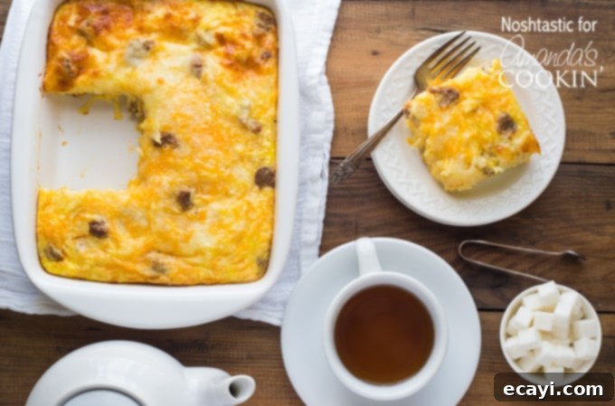 Hearty Turkey Hash Brown Breakfast Bake 4 An overhead photo of a pan of turkey hash brown breakfast casserole with a serving resting on a plate to the side.