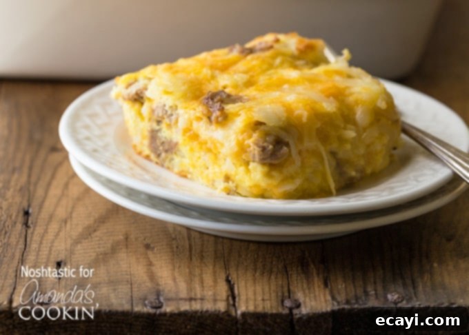 Hearty Turkey Hash Brown Breakfast Bake 5 A square serving of turkey hash brown breakfast casserole on a white plate.
