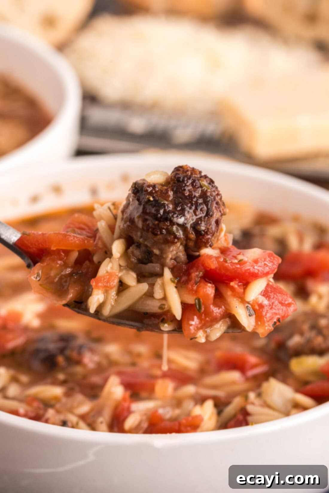 Hearty Sausage Orzo Soup 3 Close up photo of a spoonful of Italian Sausage Tomato Orzo Soup
