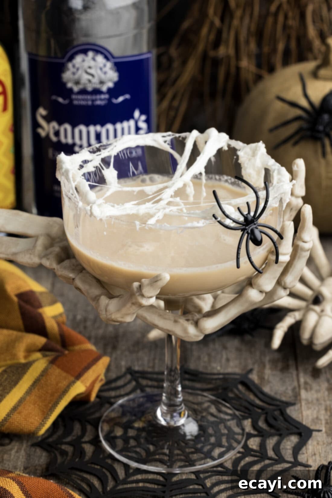 Cobweb Elixir 9 Skeleton hand holding a Spiderweb Cocktail