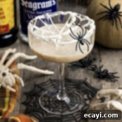 Cobweb Elixir 10 Spiderweb Cocktail with a fake spider on the glass