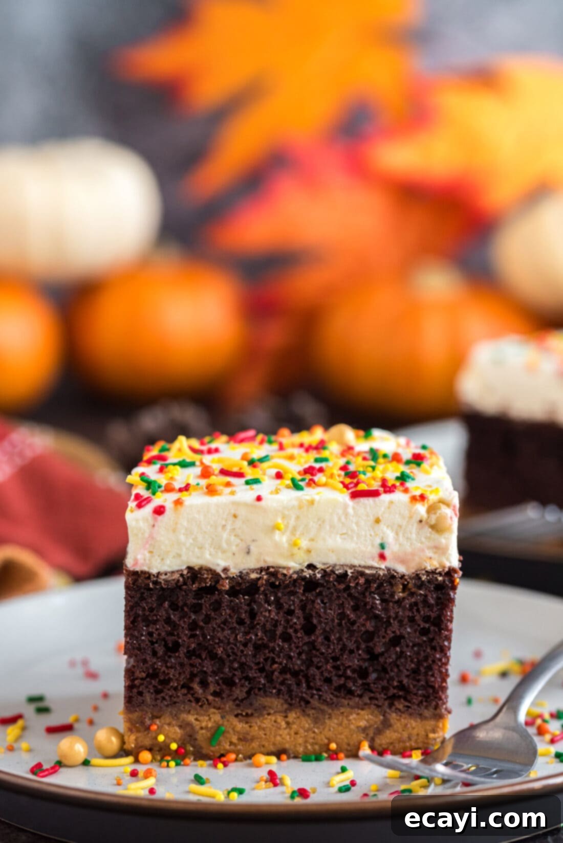 Chocolate Pumpkin Enchantment 2 Square piece of Chocolate Pumpkin Magic Cake on a plate with a fork