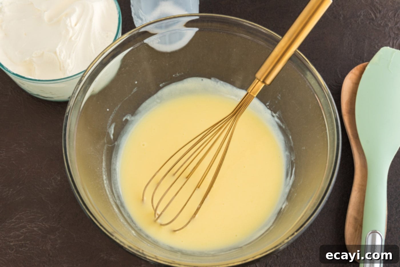 Chocolate Pumpkin Enchantment 12 vanilla instant pudding in a bowl with a whisk