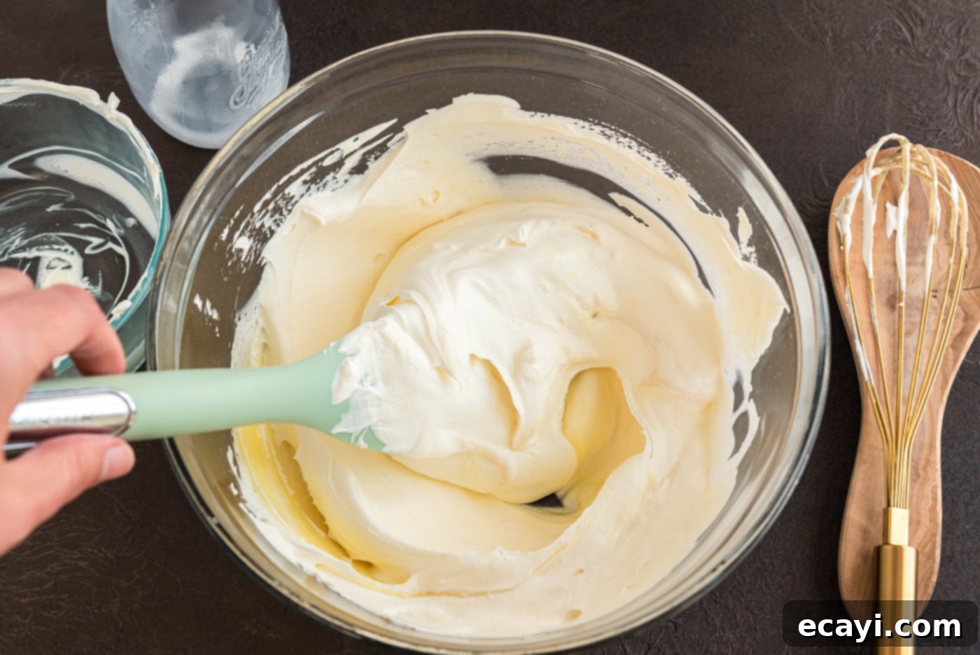 Chocolate Pumpkin Enchantment 14 prepared vanilla mousse in a bowl with a rubber spatula