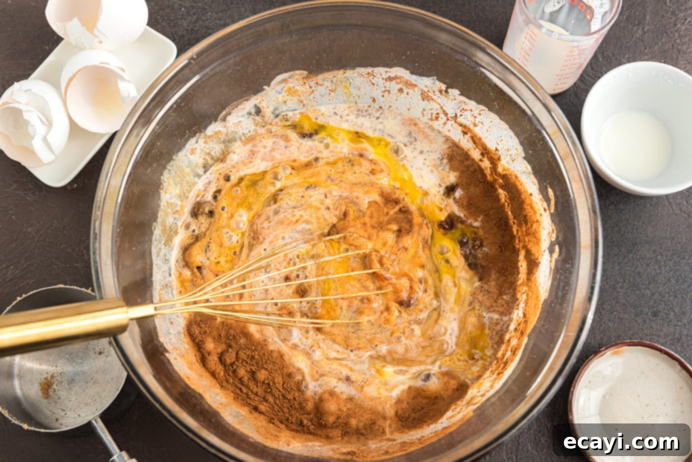 Chocolate Pumpkin Enchantment 8 whisking pumpkin pie ingredients together in a bowl