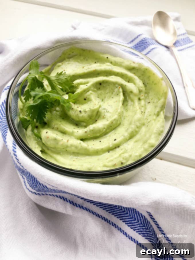 Zesty Salmon Street Tacos 5 A photo of a creamy, vibrant green bowl of avocado sauce, perfect for salmon tacos or as a dip.
