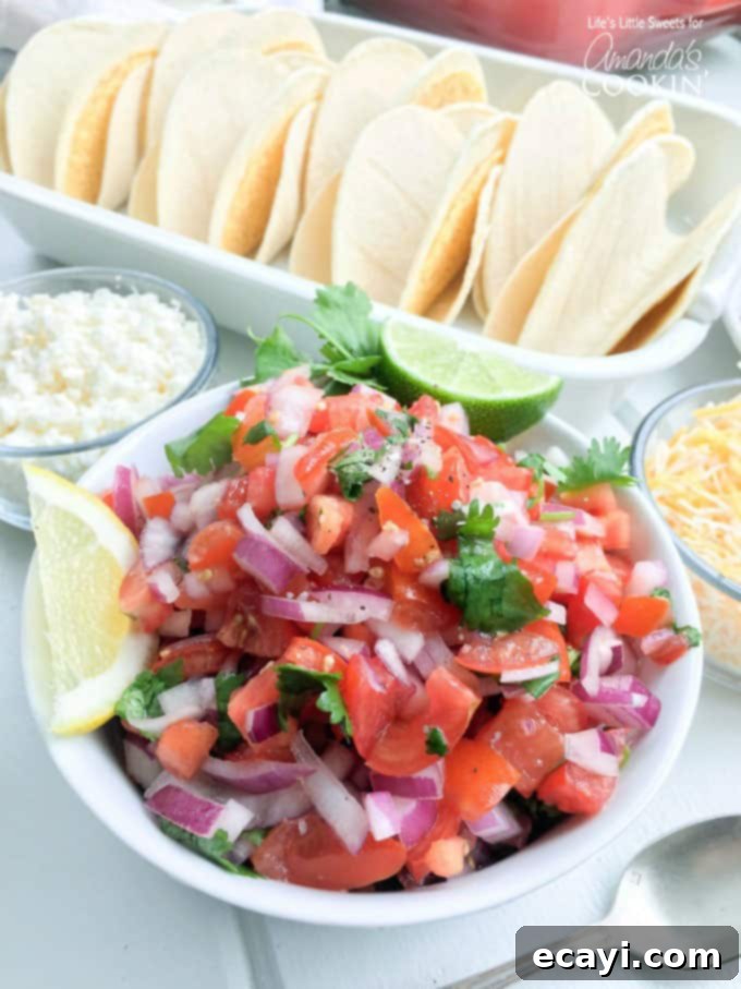 Zesty Salmon Street Tacos 6 A photo of a colorful bowl of homemade fresh salsa with diced tomatoes, red onions, and cilantro, ready for salmon tacos.