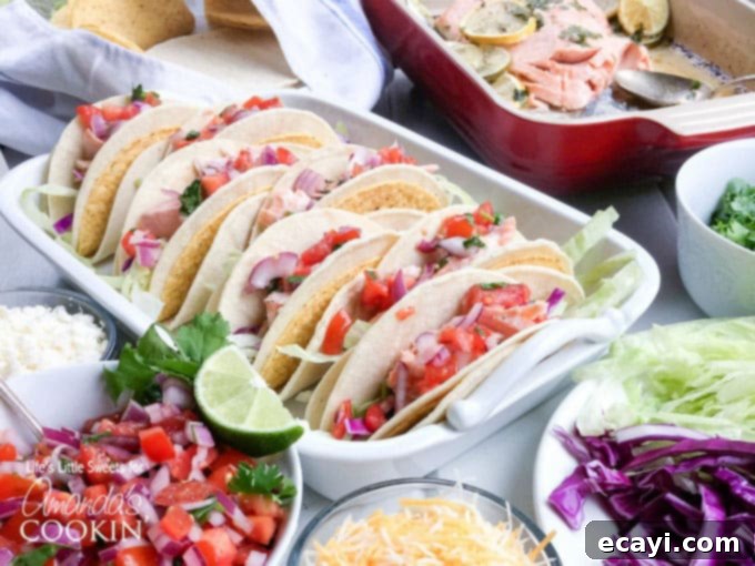 Zesty Salmon Street Tacos 7 A photo of several perfectly cooked salmon tacos presented in a rustic casserole dish, inviting and ready to be enjoyed.