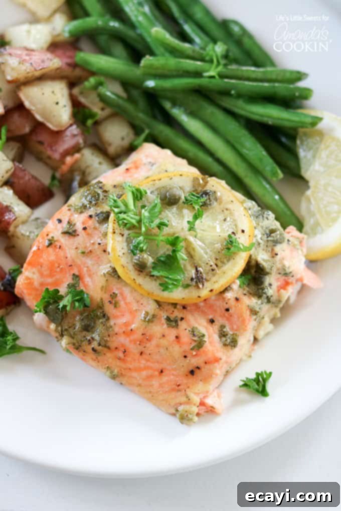 Zesty Salmon Street Tacos 10 A perfectly cooked Dijon Lemon Caper Salmon fillet, flaky and golden, garnished with fresh herbs, often served as a satisfying dinner.