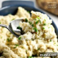 Golden Brown Butter Mash 7 A close up picture of a spoonful of mashed potatoes.
