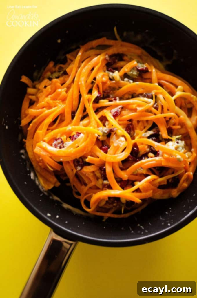 Creamy Cheesy Butternut Squash Pasta 2 A large saute pan filled with butternut squash pasta.