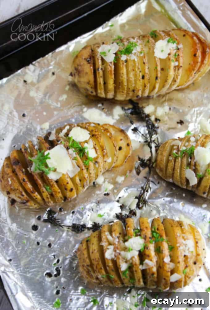Golden Fan-Cut Potatoes 10 Gorgeous Hasselback potatoes, fanned out and golden brown, garnished with fresh parsley and Parmesan cheese, presented beautifully on a plate.