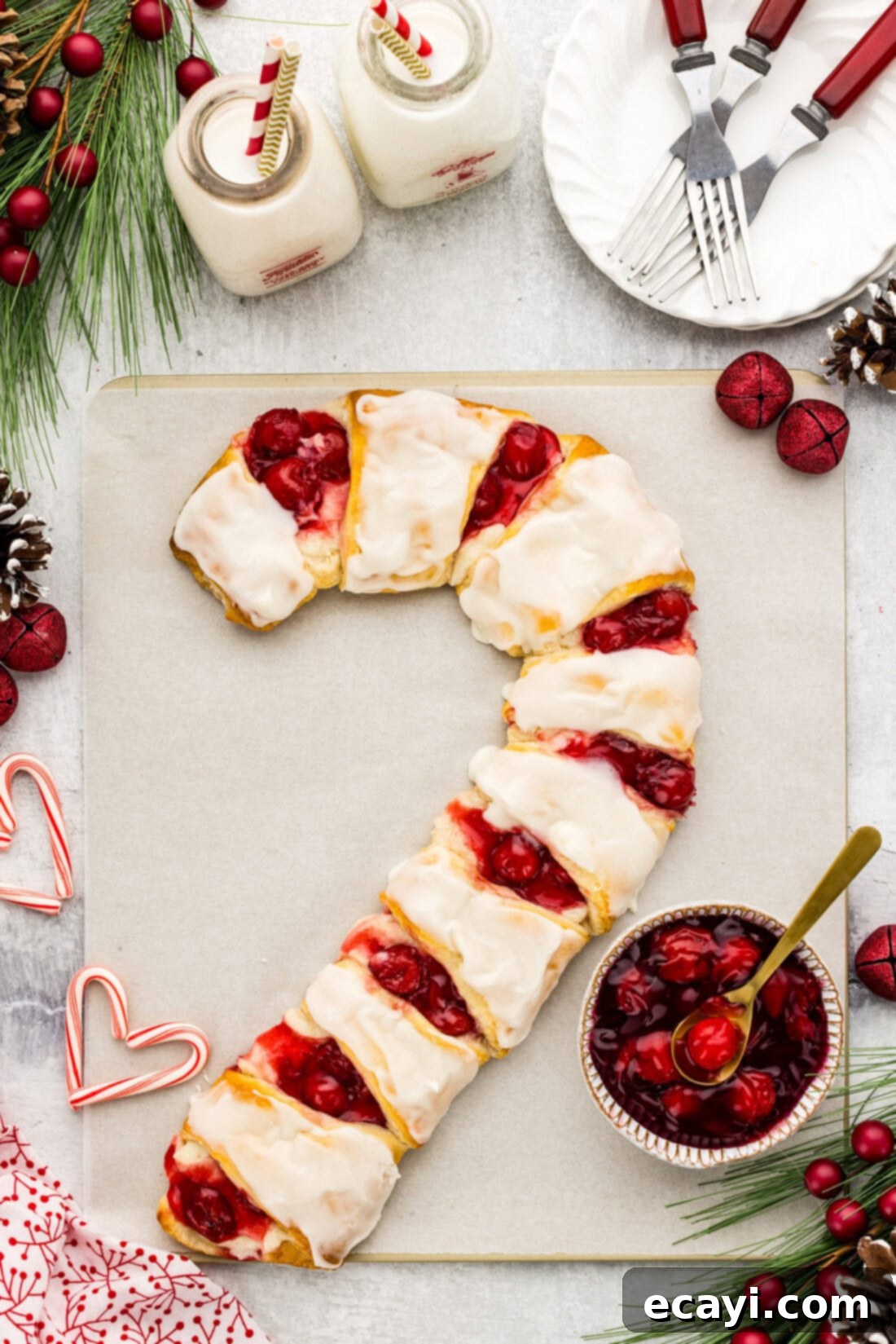 Peppermint Swirl Danish 2 Festive Candy Cane Danish with plates and extra cherry pie filling to the side, ready to be served for a delightful Christmas breakfast