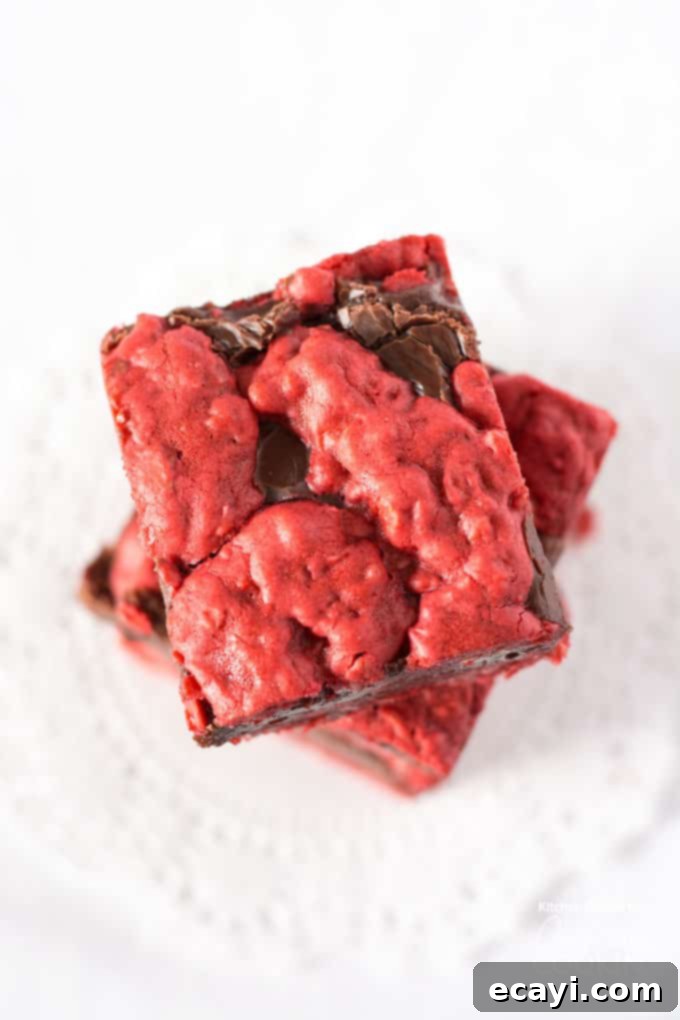Red Velvet Oatmeal Fudge Obsession 4 Red Velvet Oatmeal Fudge Bars arranged artfully, highlighting their suitability for Valentine's Day or other festive occasions.