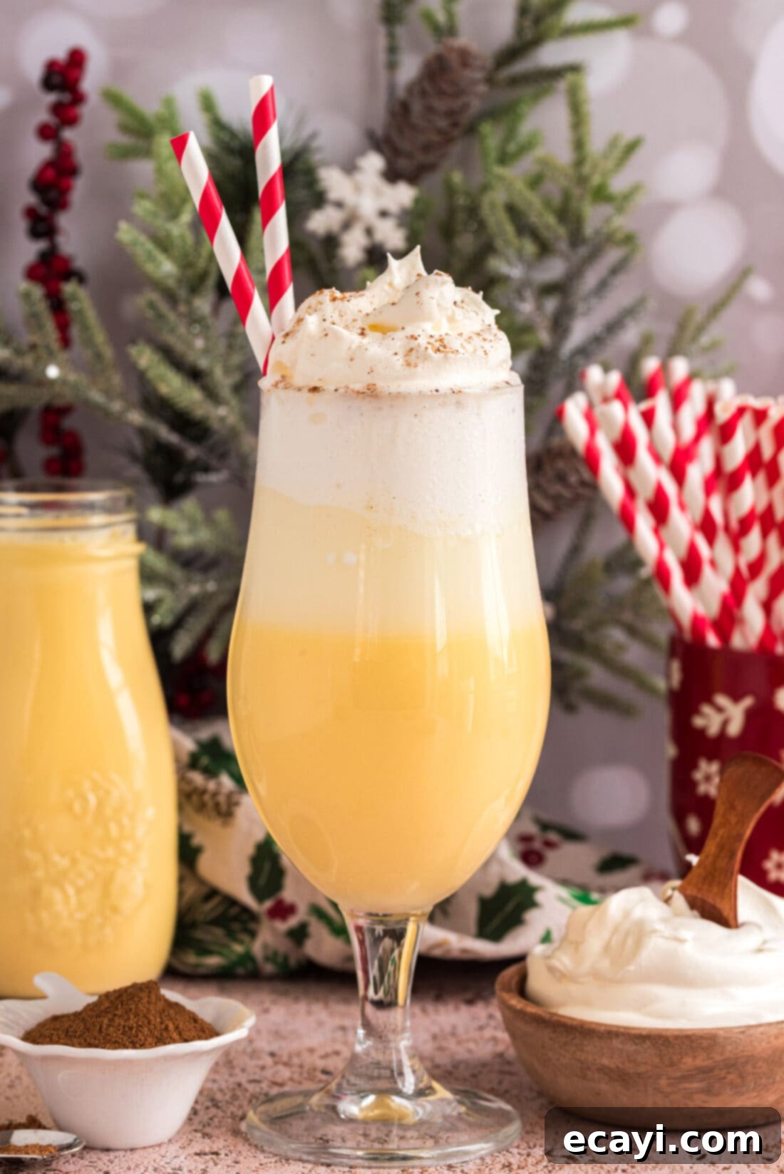 Creamy Eggnog Delight 2 Festive Eggnog Float topped generously with whipped cream and a cheerful straw