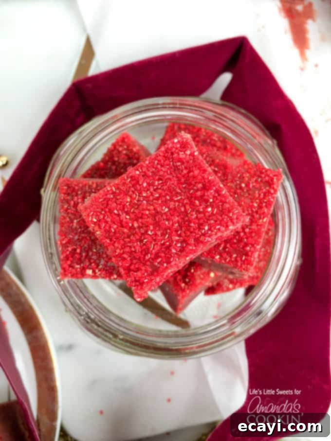 Decadent Red Velvet Fudge 6 An overhead shot showcasing multiple perfectly square pieces of red velvet fudge, neatly arranged, highlighting their festive appearance.