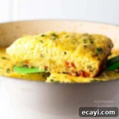 Vibrant Veggie Frittata 5 A serving of vegetable frittata on a spatula.