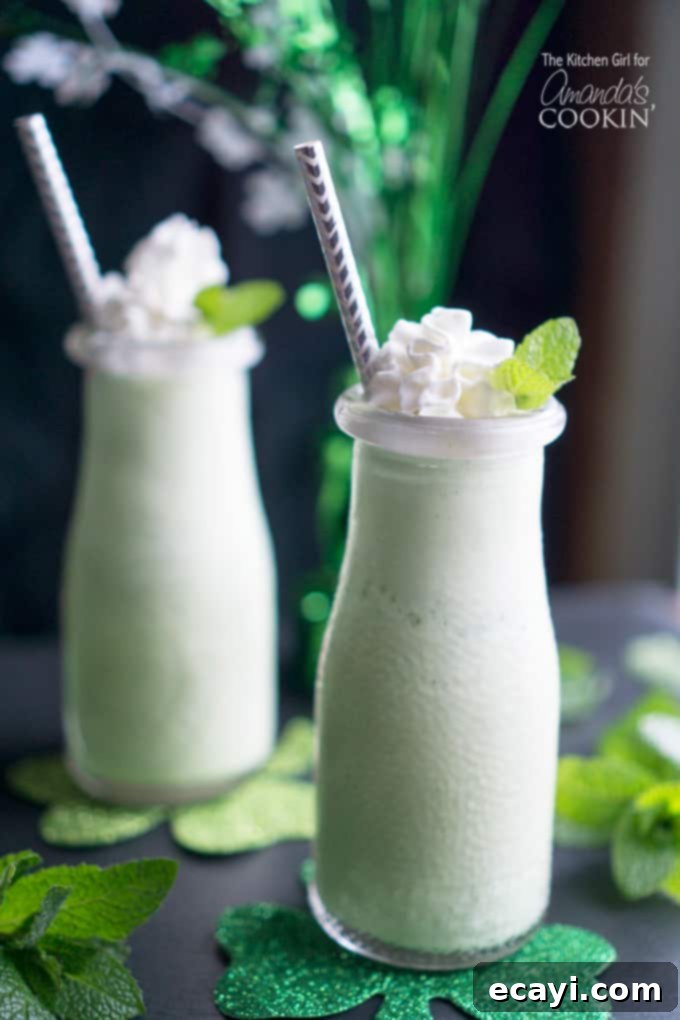 Naturally Green Shamrock Shake - ice cream shake made with fresh mint. Great way to avoid food dyes while celebrating the Irish holiday. #shamrockshake #greensmoothie #smoothierecipes #milkshake #mint #dessert #stpatricksday #milkshakerecipes Homemade naturally green shamrock shakes made with fresh mint, perfect for St. Patrick's Day without artificial food dyes.