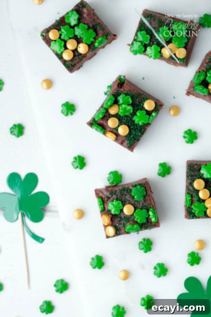 This Baileys Irish Cream Chocolate Fudge is a decadent, flavorful, and rich chocolate fudge recipe infused with Baileys Irish Cream. You'll love this one! #fudge #stpatricksday #chocolate #chocolatefudge #baileys #irish #stpattysday #dessertrecipes #candy Squares of Baileys Irish Cream Chocolate Fudge