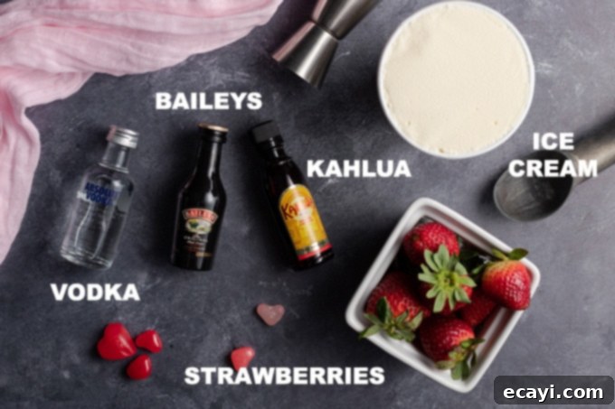Blush Avalanche 2 An array of fresh ingredients laid out for making a pink mudslide cocktail, including strawberries, ice cream, Kahlua, Bailey's, and vodka