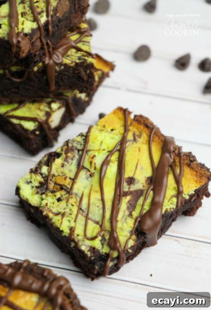 Cool Mint Swirl Brownie Cheesecake 2 A close up of a marbled mint cheesecake brownie.