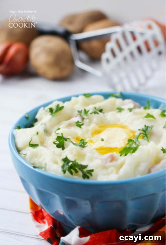 Irish Colcannon 2 A close up of luxurious Colcannon mashed potatoes, swirled to perfection in a rustic blue bowl, ready to be served as a comforting Irish meal.