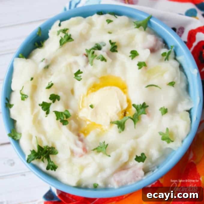 Irish Colcannon 3 A rich bowl of Colcannon mashed potatoes, elegantly garnished with freshly chopped parsley and glistening melted butter, promising a delectable Irish meal.