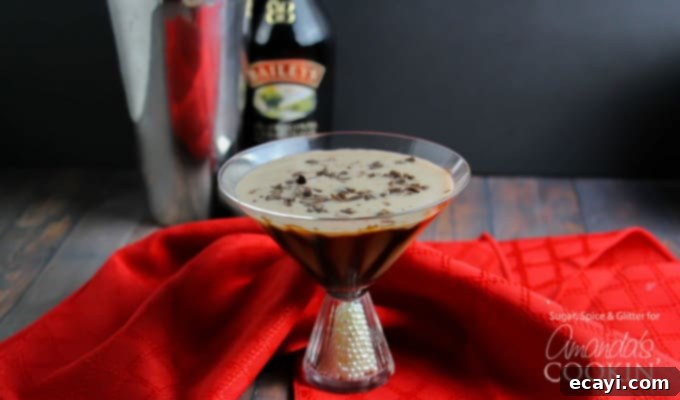 Multiple Baileys Chocolate Martinis for a party or celebration. A trio of Baileys Chocolate Martinis, showcasing the rich, creamy color and decorative chocolate syrup swirls, ready for a gathering.