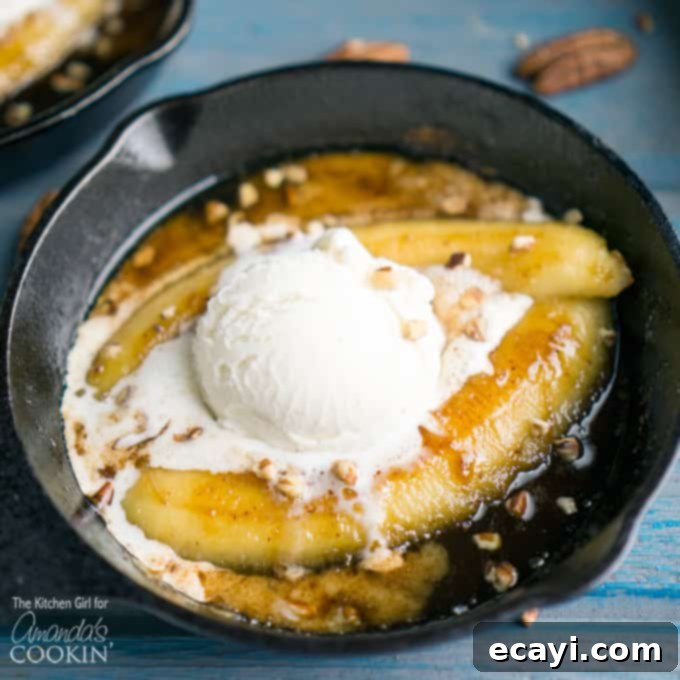 My Solo Bananas Foster Indulgence 3 A close up of single serve banana foster topped with vanilla ice cream in a 5\" skillet.