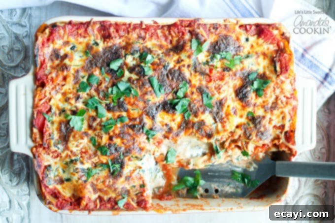 Garden Vegetable Lasagna 4 pan of veggie lasagna, slice removed, spatula where slice was