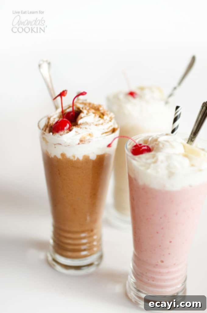 Whip Up Delicious Nice Cream Milkshakes 2 chocolate shake with a cherry, strawberry shake in foreground