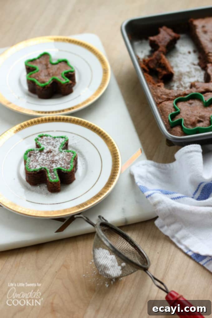 Lucky Clover Brownie Bites 4 A single shamrock shaped brownie served beautifully on a white plate, ready for decorating.