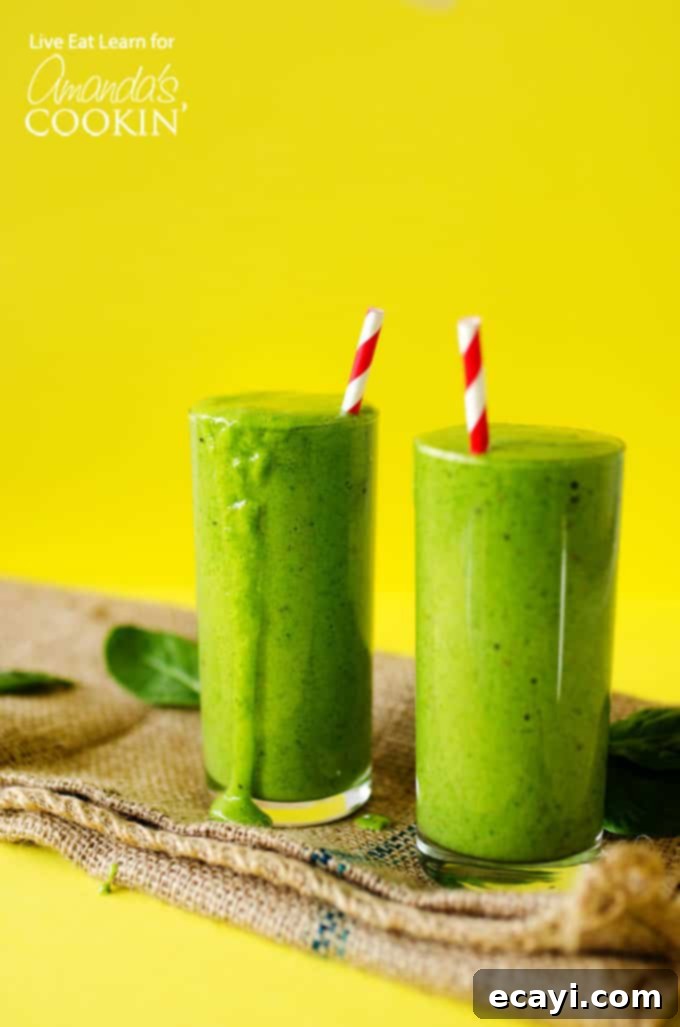 Green smoothies are an ultra simple, delicious way to kick off your day! Perfect for a healthy on-the-go breakfast or lunch packed with veggies and fruit. #greensmoothies #smoothies #smoothierecipes #greensmoothierecipe #spinach #kale #yogurt #milk #banana #fruit #flax #chia #healthy #vegetarian Fresh Green Smoothies on a yellow background, perfect for a healthy breakfast or snack.