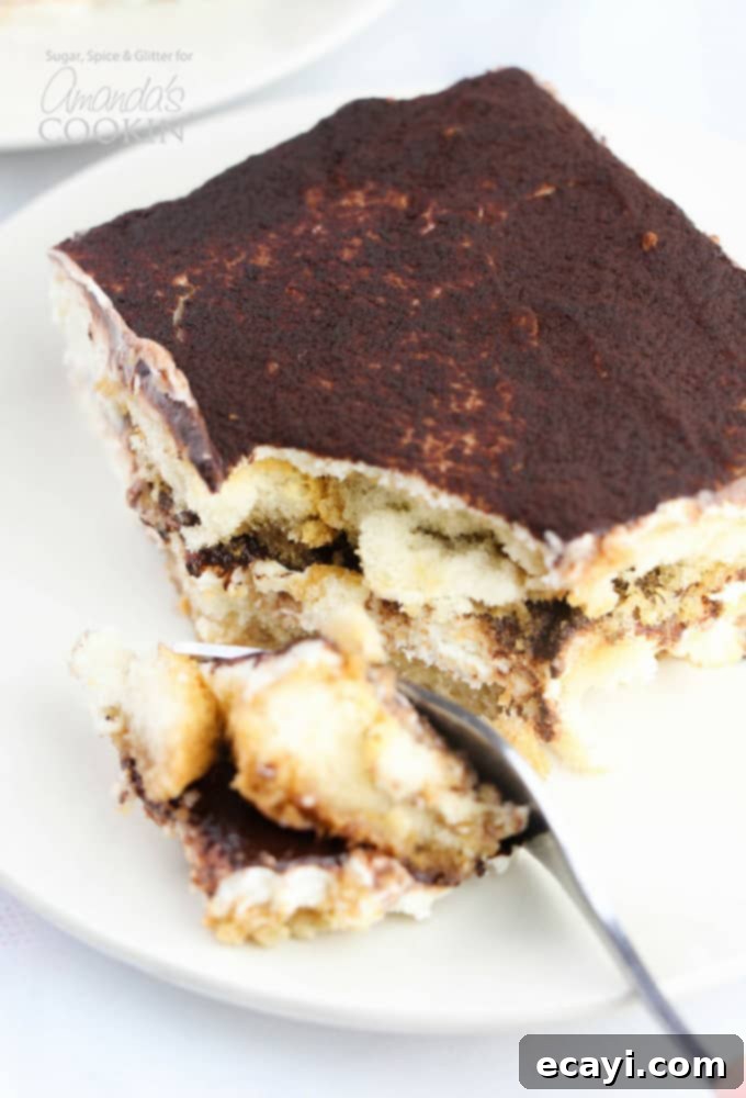 This Tiramisu Icebox Cake recipe uses classic Italian ingredients to make a delicious no-bake dessert that your guests will swear came from a bakery. Fork full of tiramisu icebox cake