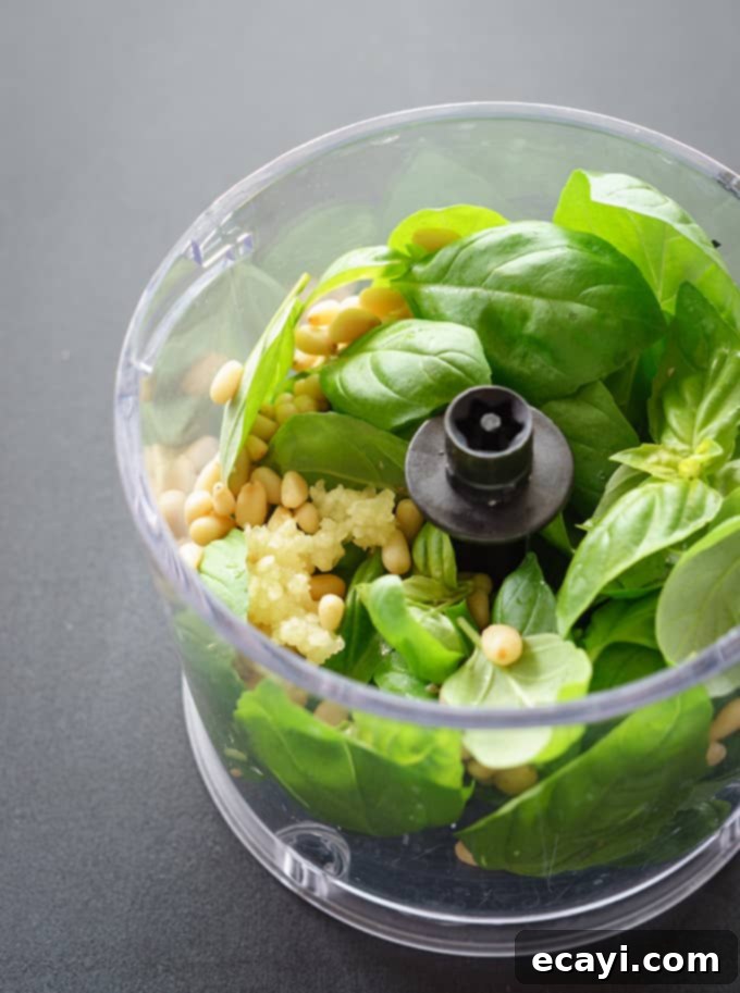 A mini food processor, also known as a food chopper, is a versatile kitchen appliance for small tasks. Food Processor with food in it