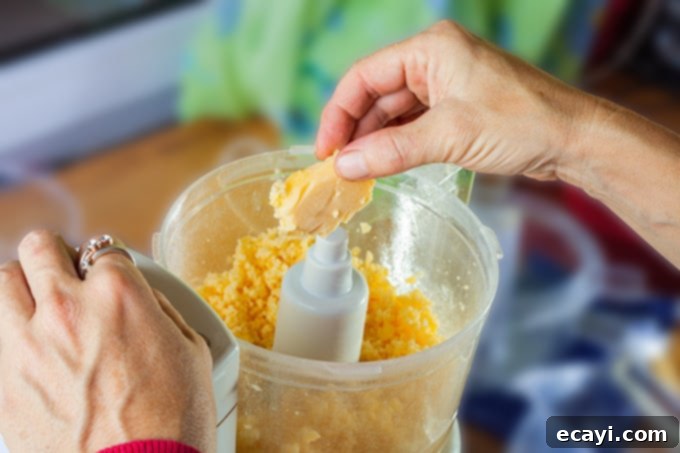 Utilize your mini food processor for efficient and precise food preparation. Putting food into a mini food processor
