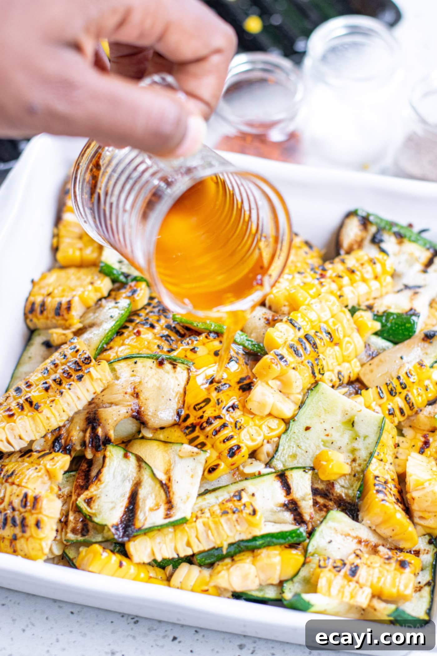Grilled Corn, Zucchini and Feta Salad 11 Assembling the salad, adding olive oil, lemon juice, and feta to grilled corn and zucchini.