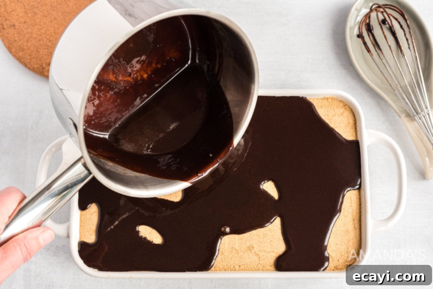 Decadent Eclair Delight 13 pouring warm chocolate ganache over the top layer of the eclair cake