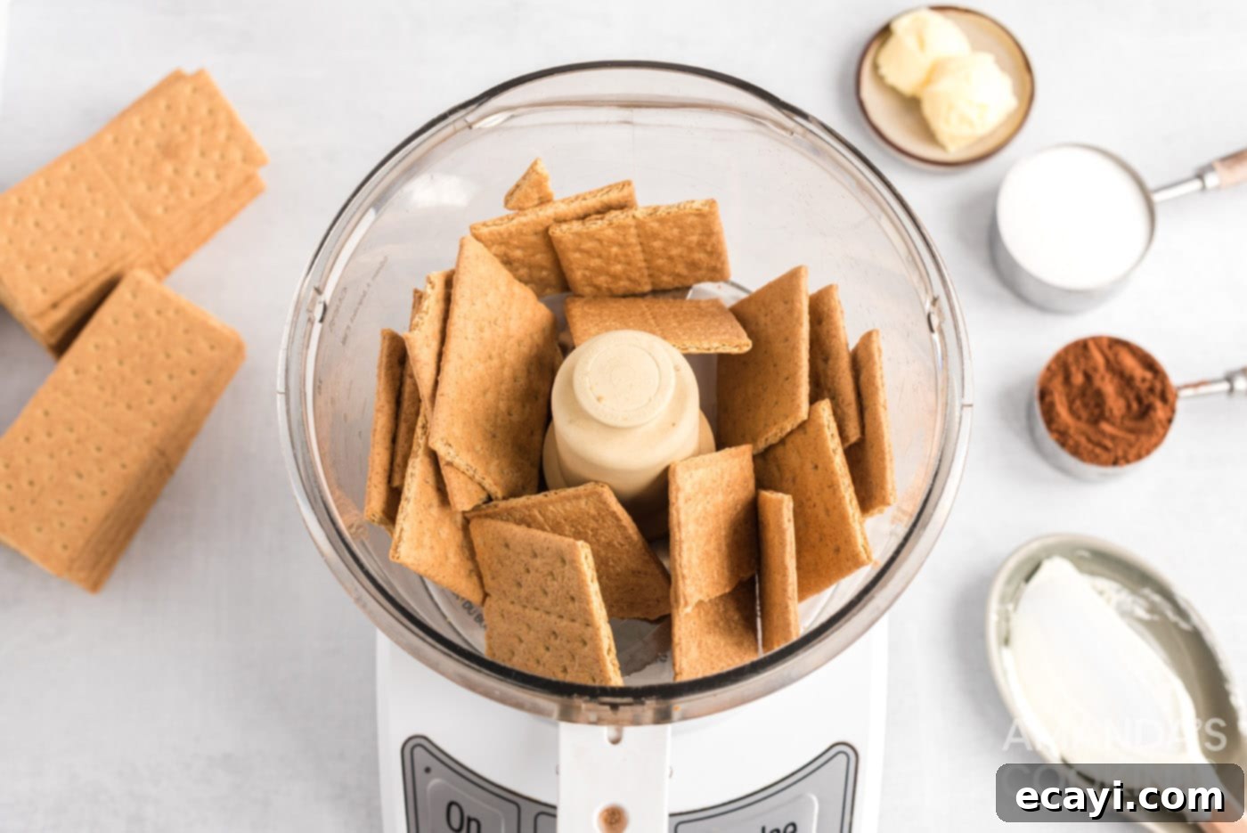 Decadent Eclair Delight 8 graham crackers being pulsed in a food processor to create crumbs