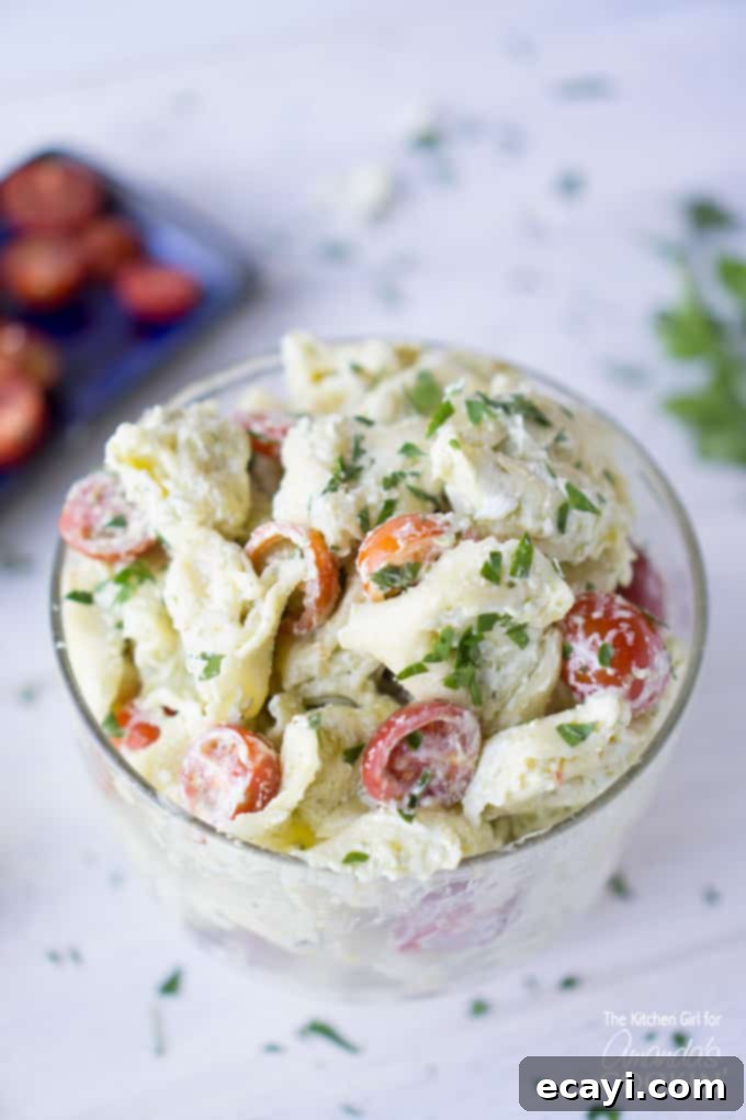 Zesty Pesto Tortellini Salad 2 Delicious Tortellini Pesto Pasta Salad in a glass serving dish, ready for summer parties