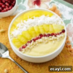 Island Bliss Bowl 2 Tropical Smoothie Bowl on orange napkin, ready to be enjoyed