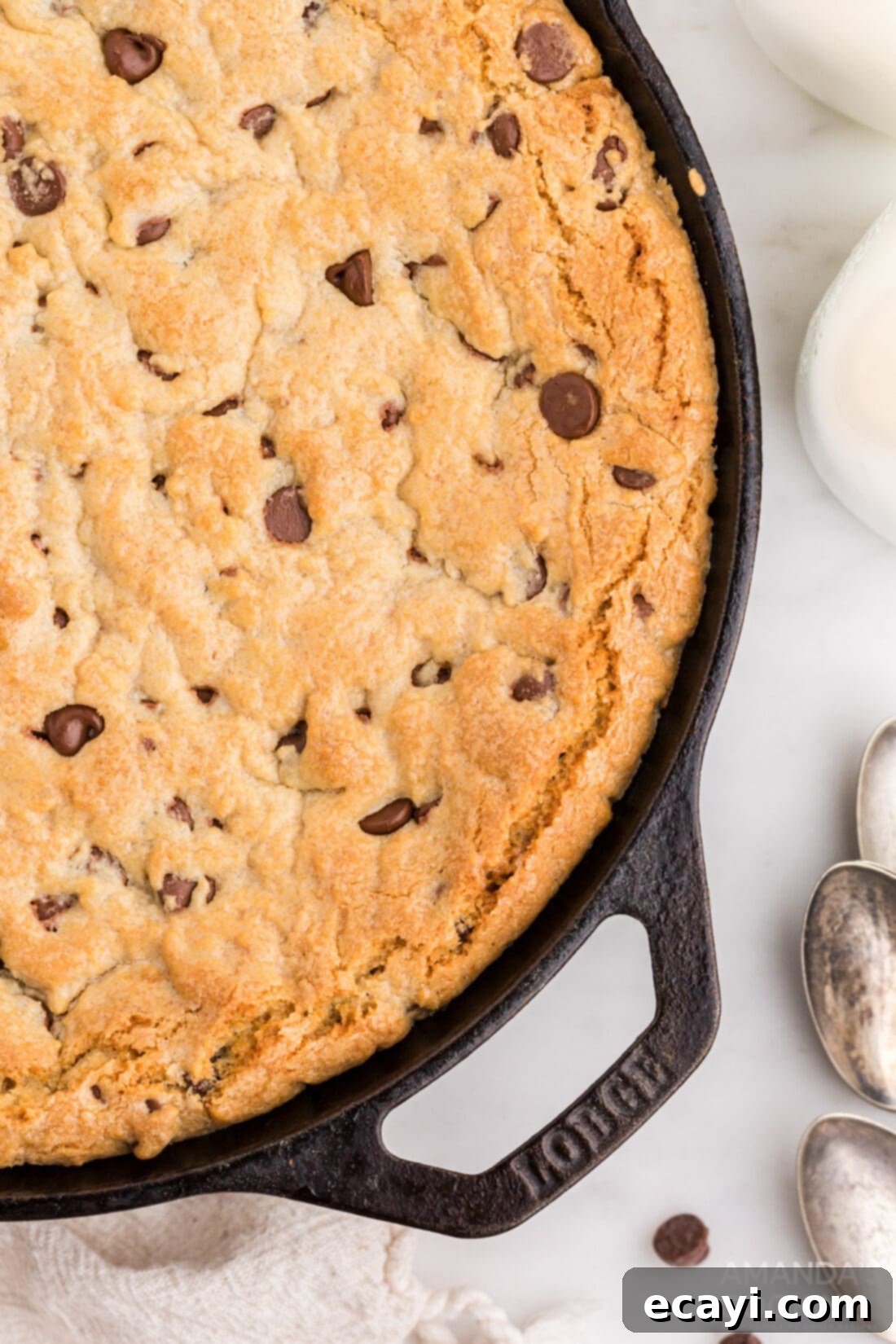 Decadent Skillet Chocolate Chip Cookie 3 Close-up of a golden brown chocolate chip cookie skillet, showing its crispy edges and soft center